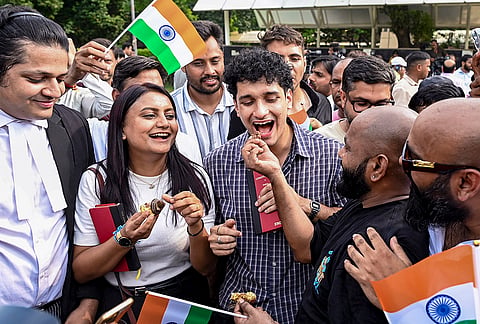 Cockroach Janta Party (CJP) spokesperson Saurav Das and party leader Ratna Singh celebrate with supporters outside the Supreme Court after a hearing on the quashing of FIRs registered against students who participated in nationwide NEET protests, in New Delhi.