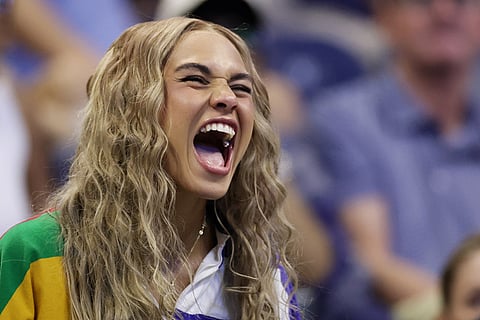 Soccer player Trinity Rodman reacts as her boyfriend Ben Shelton, of the United States, competes against Tallon Griekspoor, of the Netherlands, during the first round of the U.S. Open tennis championships in New York.