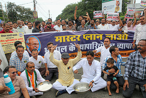 Traders stage a protest against the sealing action by the Bhopal Municipal Corporation (BMC) for commercial activities in residential areas, in Bhopal.