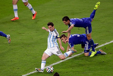 Argentina's Lionel Messi scores his team's second goal during the group F World Cup soccer match against Bosnia in Rio de Janeiro, Brazil, June 15, 2014. 