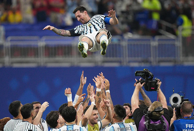 Argentina players toss teammate Lionel Messi (10) into the air as they celebrate after the World Cup round of 16 soccer match between Argentina and Egypt in Atlanta, July 7, 2026.