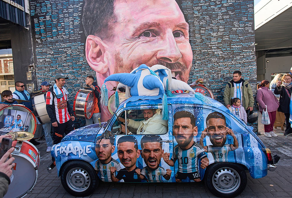 People sing happy birthday to Lionel Messi at a street mural of him in Buenos Aires, Argentina, June 24, 2026.