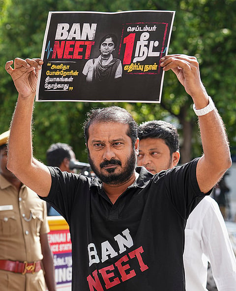 Manithaneya Jananayaga Katchi (MJK) President and Chidambaram MLA M Thamimun Ansari arrives at the Tamil Nadu Legislative Assembly wearing a t-shirt bearing the message ban NEET and holds a placard marking the ninth death anniversary of S Anitha, in Chennai. Anitha, who had sought exemption for Tamil Nadu from NEET, died by suicide on September 1, 2017, after allegedly failing to secure a medical seat. 