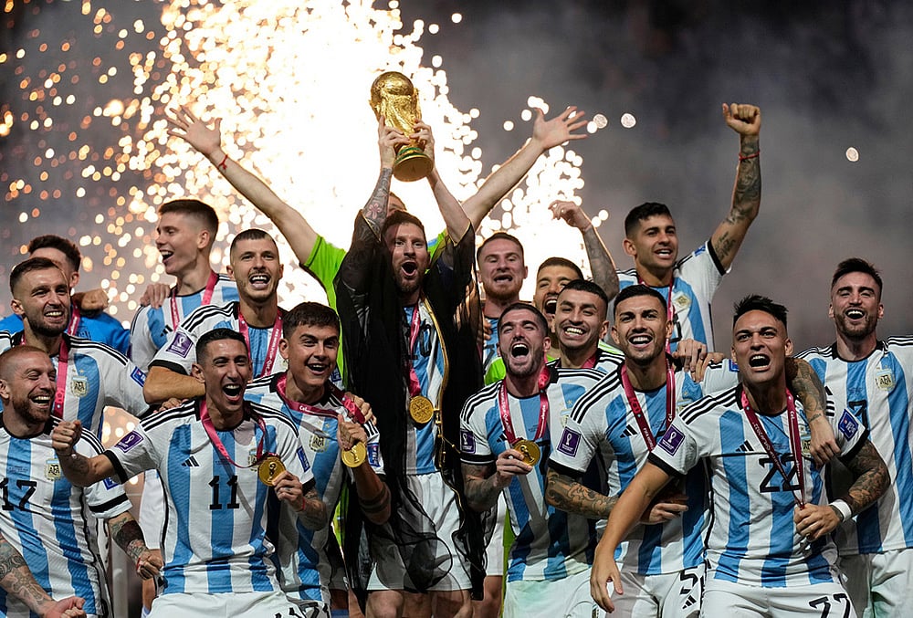 Argentinas Lionel Messi lifts the trophy after winning the World Cup final soccer match between Argentina and France in Lusail, Qatar, Dec. 18, 2022. Argentina won 4-2 in a penalty shootout after the match ended tied 3-3. 