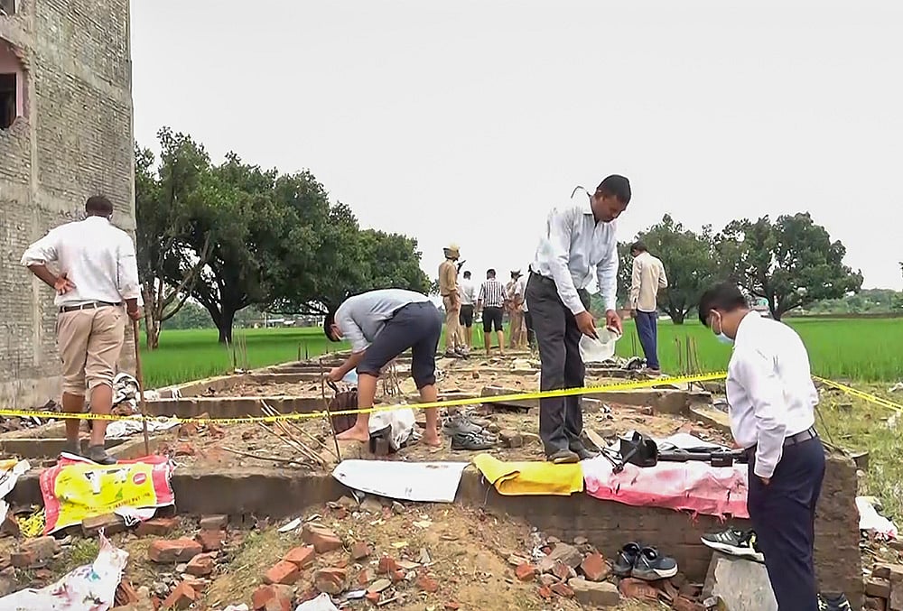 Forensic officials inspect Kaushambi explosion site