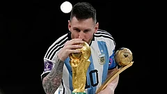 Argentina's Lionel Messi kisses the trophy after winning the World Cup final soccer match between Argentina and France in Lusail, Qatar, Dec. 18, 2022. Argentina won 4-2 in a penalty shootout after the match ended tied 3-3. - | Photo: AP/Martin Meissner, File
