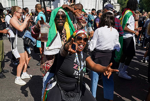 Revellers celebrate the Notting Hill Carnival in London, Monday, Aug. 31, 2026. 