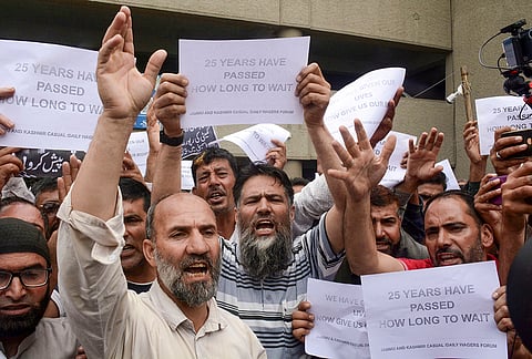 Jammu and Kashmir Casual Daily Wagers Forum members stage a protest demanding regularisation of their services, in Srinagar.