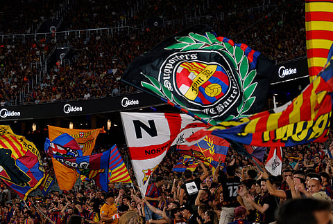 Barcelona supporters cheer from the stands during a Spanish La Liga soccer match between Barcelona and Rayo Vallecano in Barcelona, Spain, Monday, Aug. 31, 2026.
