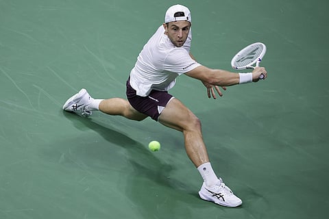 Tallon Griekspoor, of the Netherlands, returns the ball to Ben Shelton, of the United States, during the first round of the U.S. Open tennis championships in New York.