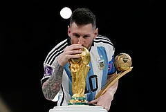 Argentina's Lionel Messi kisses the trophy after winning the World Cup final soccer match between Argentina and France in Lusail, Qatar, Dec. 18, 2022. Argentina won 4-2 in a penalty shootout after the match ended tied 3-3. - | Photo: AP/Martin Meissner, File