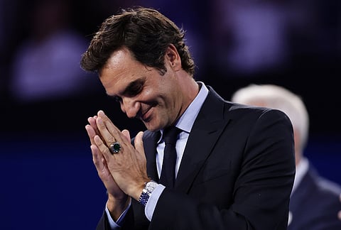 Roger Federer, former tennis player, gestures as he receives his Hall of Fame ring at the U.S. Open tennis championships Monday, Aug. 31, 2026, in New York. 