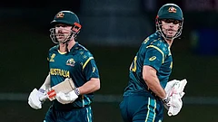 Australia's Travis Head and captain Mitchell Marsh run between the wickets during the T20 World Cup cricket match between Australia and Oman in Pallekele, Sri Lanka. - | Photo: AP/Eranga Jayawardena