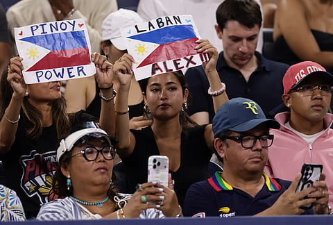 Fans of Alexandra Eala, of the Philippines, hold up signs during her match against Mary Stoiana, of the United States, in the first round of the U.S. Open tennis championships Tuesday, Sept. 1, 2026, in New York. 
