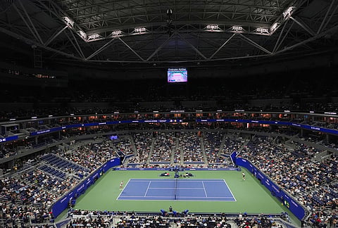 Fans watch Lorenzo Sonego, left, of Italy, play Alexander Zverev, of Germany, in the first round of the U.S. Open tennis championships Tuesday, Sept. 1, 2026, in New York. 