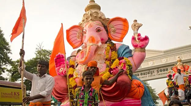 Large Lord Ganesha idol displayed during a Ganesh Chaturthi procession.