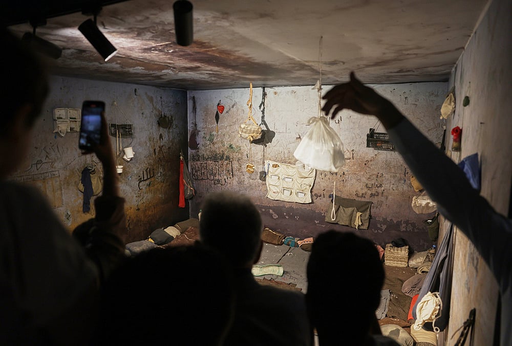 Visitors view a recreation of a cell at Military Security Branch 248 containing original items from the facility, at "When the Walls Speak," an exhibit at the Damascus International Fair about prisons during the rule of former President Bashar Assad, in Damascus, Syria, Monday, Aug. 31, 2026. - | Photo: AP/Ghaith Alsayed