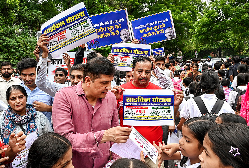 Saurabh Bharadwaj distributes pamphlets outside school in Delhi