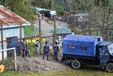 Security personnel dispatch relief material sent by India in the aftermath of the recent flash floods, at an army base camp, in Rasuwa district, Nepal.