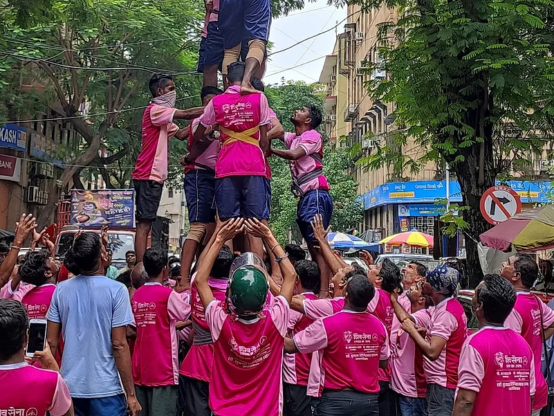 Dahi Handi human pyramid forming during festival