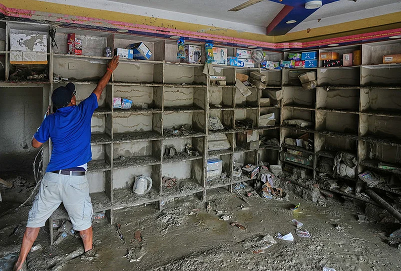 People salvaging belongings after flood