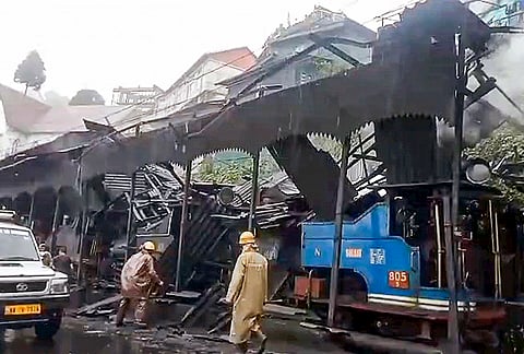 Security personnel inspect the site after a portion of the roof of the Darjeeling loco shed collapsed following heavy rains, in Darjeeling, West Bengal, Wednesday, Sept. 2, 2026. As per officials, seven people, including a contractual employee, were injured in the incident, which occurred while four heritage steam locomotives were parked inside the facility. 