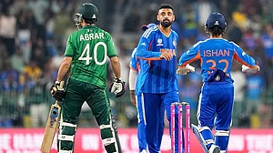 | Photo: AP/Eranga Jayawardena : India's Varun Chakravarthy, center, celebrates the wicket of Pakistan's Abrar Ahmed, left, during the T20 World Cup cricket match between India and Pakistan in Colombo, Sri Lanka.
