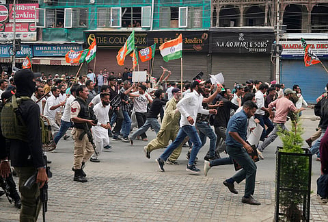 Activists of India's ruling Bharatiya Janata Party (BJP) march during a protest against the National Conference (NC)-led regional government over rising electricity tariffs, unemployment and alleged governance failures in Srinagar, Indian-controlled Kashmir, Wednesday, Sept. 2, 2026. 
