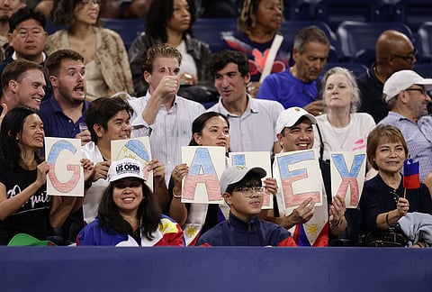 Fans of Alexandra Eala, of the Philippines, spell out "GO ALEX" with letters before her match against Mary Stoiana, of the United States, in the first round of the U.S. Open tennis championships Tuesday, Sept. 1, 2026, in New York. 