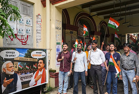 ABVP activists carry the Tricolour during a rally on the Jadavpur University campus, in Kolkata.