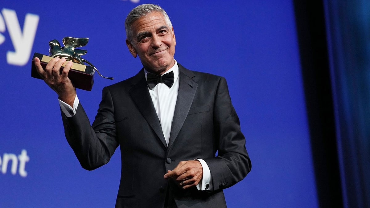 George Clooney poses with the golden lion for lifetime achievement during the opening ceremony of the 83rd edition of the Venice Film Festival in Venice, Italy, on Wednesday, Sept. 2, 2026.  - (Photo by Scott A Garfitt/Invision/AP)