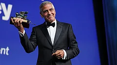 George Clooney poses with the golden lion for lifetime achievement during the opening ceremony of the 83rd edition of the Venice Film Festival in Venice, Italy, on Wednesday, Sept. 2, 2026. - (Photo by Scott A Garfitt/Invision/AP)