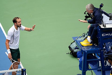 Daniil Medvedev, of Russia, left, talks with the official during the second round of the U.S. Open tennis championships against Sebastian Gorzny, of the United States in New York.
