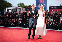 | Photo: Scott A Garfitt/Invision/AP : George Clooney, left, recipient of the golden lion for lifetime achievement and Laura Dern pose for photographers during the 83rd edition of the Venice Film Festival in Venice, Italy, on Wednesday, Sept. 2, 2026. 