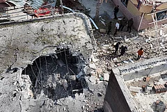 People inspect damage and debris at a building that Iranian media said was hit by a U.S. strike while a wedding celebration was taking place there, in Kuhestak, southern Iran, Wednesday, Sept. 2, 2026. - | Photo: Morteza Akhoondi/Tasnim News Agency via AP