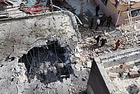 In Photos | Fresh US-Iran Strikes Spark Fears of Wider Middle East Conflict | Photo: Morteza Akhoondi/Tasnim News Agency via AP : People inspect damage and debris at a building that Iranian media said was hit by a U.S. strike while a wedding celebration was taking place there, in Kuhestak, southern Iran, Wednesday, Sept. 2, 2026.
