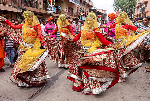 Artists perform during a procession on the eve of Janmashatmi festival, in Mathura, Uttar Pradesh.