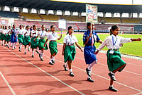 | Photo: PTI : Students march during a mass jogging event on the 43rd Abhiruchi Sports Day, marking the birth anniversary of the state’s first Arjuna Awardee Bhogeswar Baruah, in Guwahati.