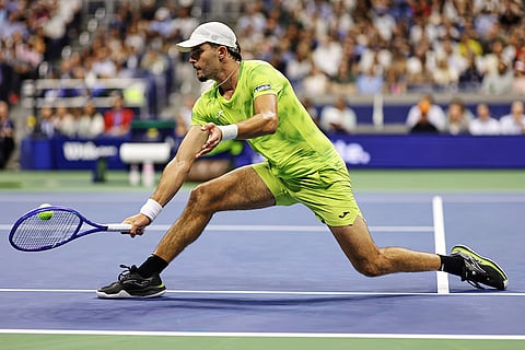 Jaime Faria, of Portugal, returns the ball to Carlos Alcaraz, of Spain, during the second round of the U.S. Open tennis championships in New York.