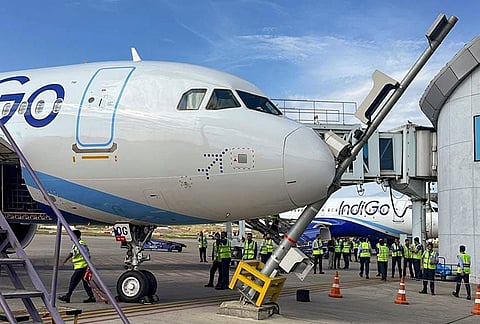 Ground staff attend to an IndiGo aircraft after flight 6E 225 (VT-NOG), operating from Navi Mumbai to Srinagar, hit a pole while being parked at Srinagar airport, in Srinagar, Jammu and Kashmir.