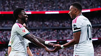 Manu Fernandez/AP Photo : Real Madrid's Kylian Mbappe, right, celebrates with Real Madrid's Vinicius Junior after scoring his sides third goal during the La Liga soccer match between Real Madrid and Malaga in Madrid.