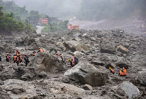 In this image posted on Aug. 29, 2026, Rescue efforts continue for the second day to evacuate people reportedly trapped inside a tunnel of the Trishuli 3 ‘A’ Hydropower Project, with teams working to clear the debris blocking its entrance, in Rasuwa. 