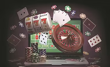 Laptop surrounded by flying casino chips, slots, and roulette