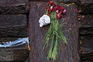 | Photo: AP/Niranjan Shrestha : An effigy of a person missing in the deadly flash floods is placed for rituals during a symbolic funeral on the banks of the Bagmati River near Pashupatinath Temple in Kathmandu, Nepal.