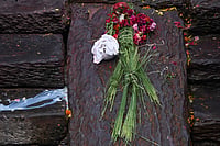 In Photos: Symbolic Funeral Held For Nepal Flood Victims | Photo: AP/Niranjan Shrestha : An effigy of a person missing in the deadly flash floods is placed for rituals during a symbolic funeral on the banks of the Bagmati River near Pashupatinath Temple in Kathmandu, Nepal.