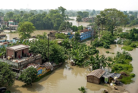 An aerial view shows houses partially submerged in floodwaters after a rise in the water level of the Ganga river, in Vaishali district, Bihar, Friday, Sept. 4, 2026. 