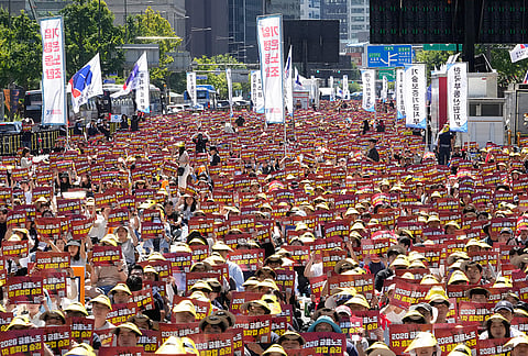 Striking members of the Korea Financial Industry Union stage a rally to oppose the government's plans to relocate policy lenders and other public financial organizations from Seoul to provincial areas in Seoul, South Korea. The banners read "Victory in the 2026 Financial Industry Union's first strike." 