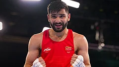 India's Sachin Siwach celebrates after winning the men's 60kg final boxing bout against Namibia's Tryagain Morning Ndevelo, unseen, at the 23rd Commonwealth Games (CWG), in Glasgow, Scotlan. Siwach bagged gold in the event. - Photo: PTI/Ravi Choudhary