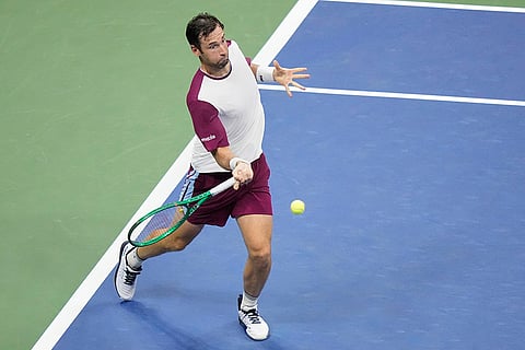 Quentin Halys, of France, hits a return to Alexander Zverev, of Germany, during the second round of the U.S. Open tennis championships in New York.