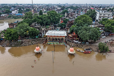 An aerial view of the partially submerged Balua Ghat as the water level of the Yamuna river rises following heavy rainfall, in Prayagraj, Uttar Pradesh.